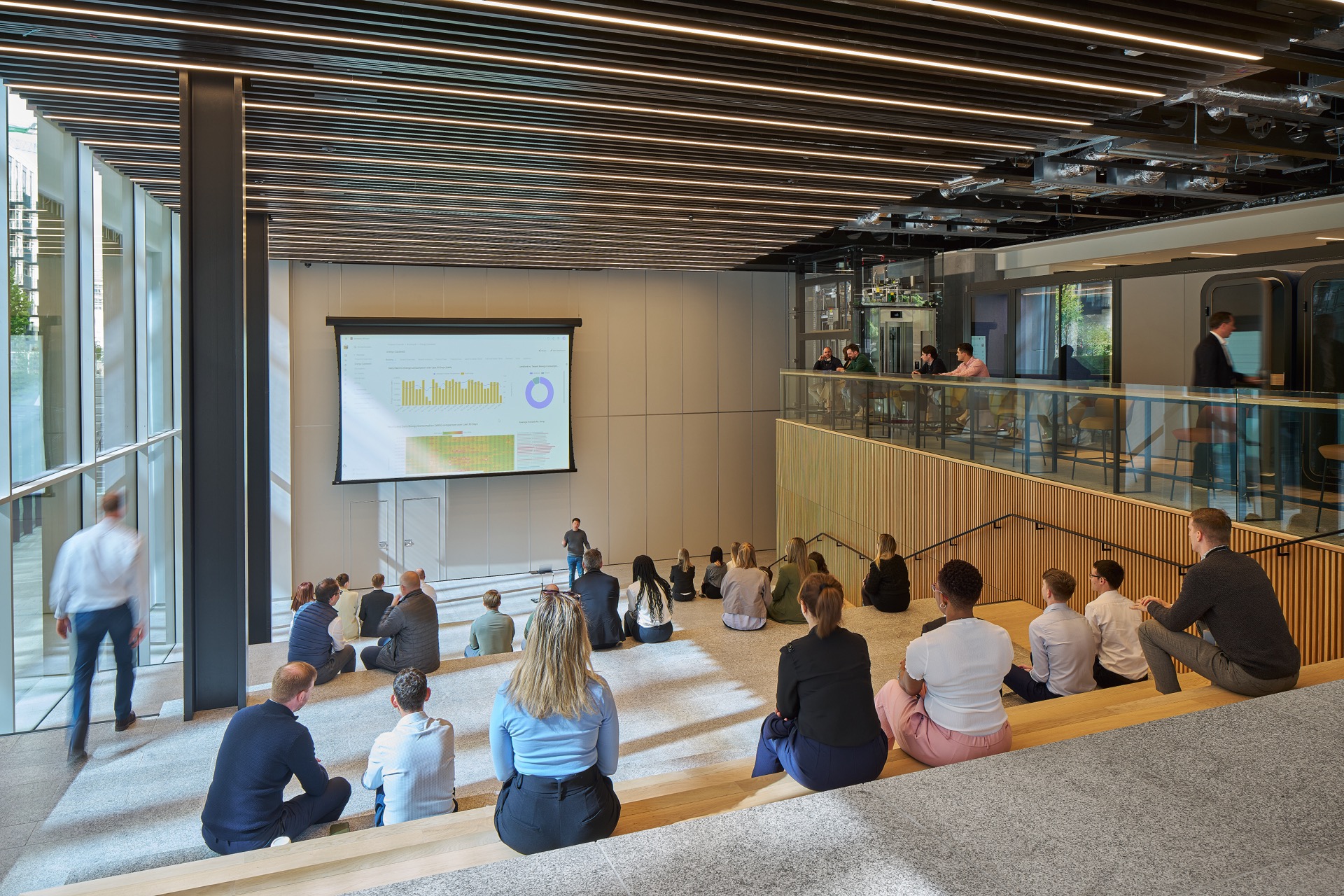 town hall space being used by public and office workers as a workspace and collaboration area